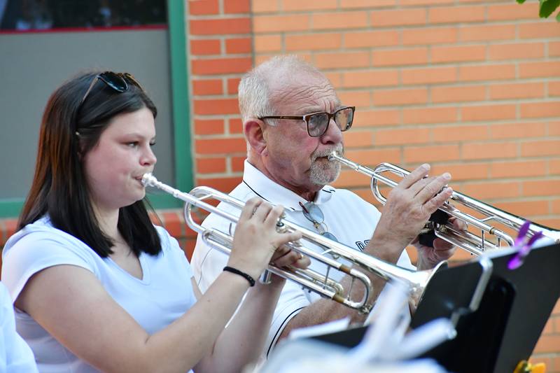 Playing trumpet for the Peru Municipal Band are (from left) Grace Eitutis and John Weiss.