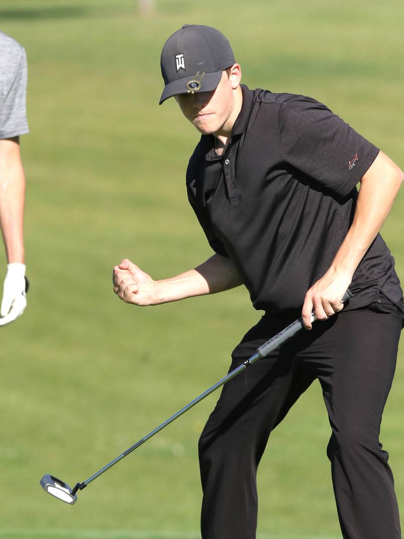 DeKalb's Daniel Rowan Jr. reacts after sinking a par putt on the 4th hole Tuesday, Aug. 9, 2022, during golf practice at River Heights Golf Course in DeKalb.