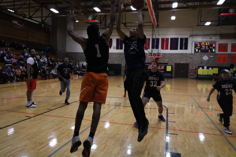 Marcus Jones shoots his shot Monday, Dec. 2, 2024, at the annual charity basketball game held at Huntley Middle School in DeKalb.