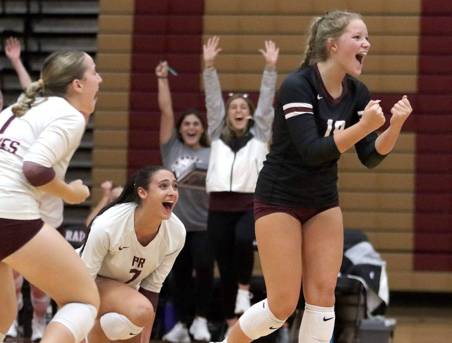 Prairie Ridge’s Tegan Vrbancic and the Wolves celebrate a win in varsity girls volleyball at Huntley High School in Huntley on Thursday, Sept. 11, 2025.