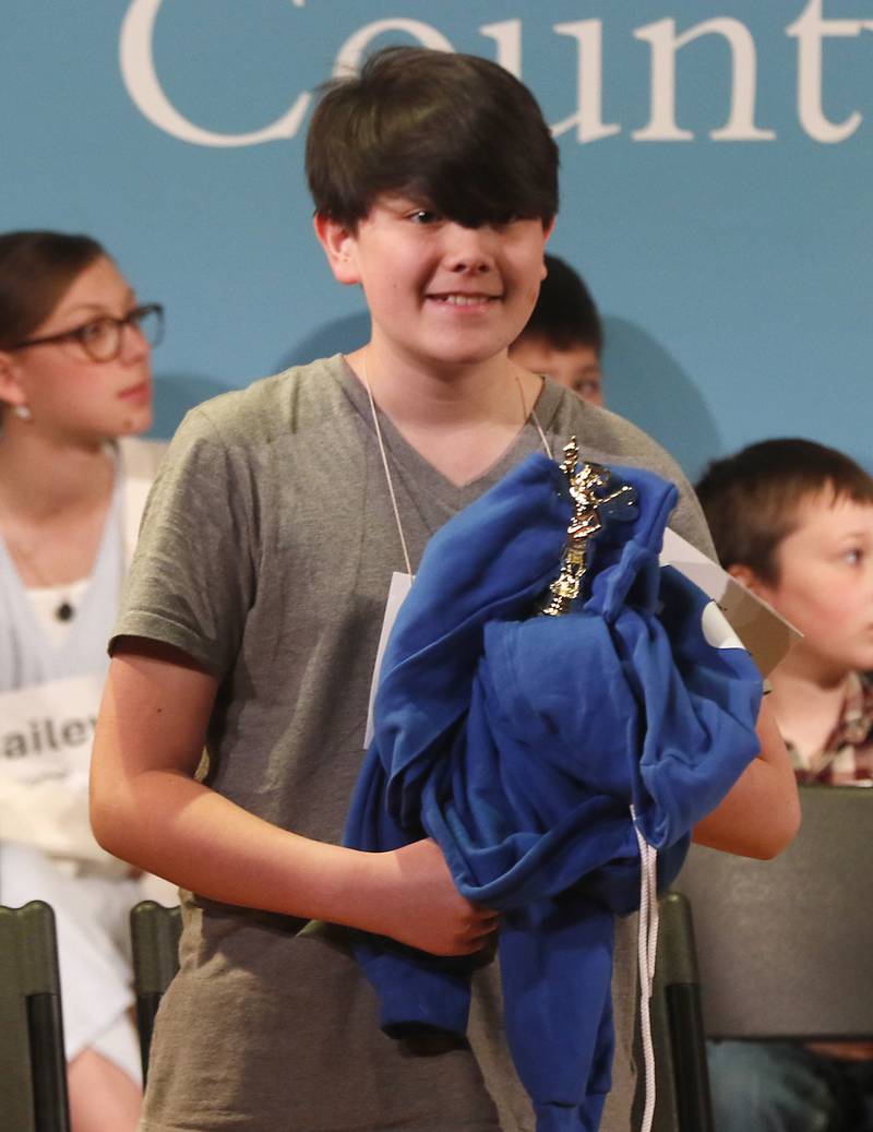 Evan Cochrane, of Immanuel Lutheran School, smiles after he won the McHenry County Regional Office of Education 2024 Spelling Bee Wednesday, March 20, 2024, at McHenry County College's Luecht Auditorium in Crystal Lake.