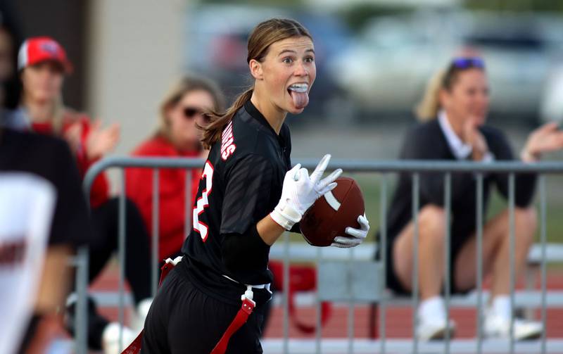 Huntley’s Aubrina Adamik is all smiles on her third touchdown of the night against McHenry in varsity flag football at Huntley High School in Huntley on Tuesday, Sept. 9, 2025.