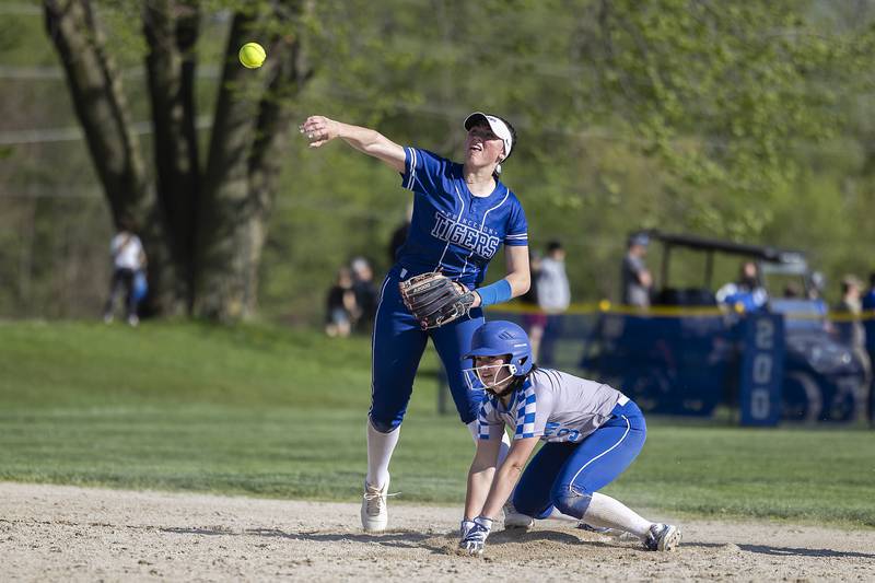 Princeton’s Keely Lawson steps on second ahead of Newman’s Addison Foster and fires to first to complete a double play Monday, April 29, 2024.