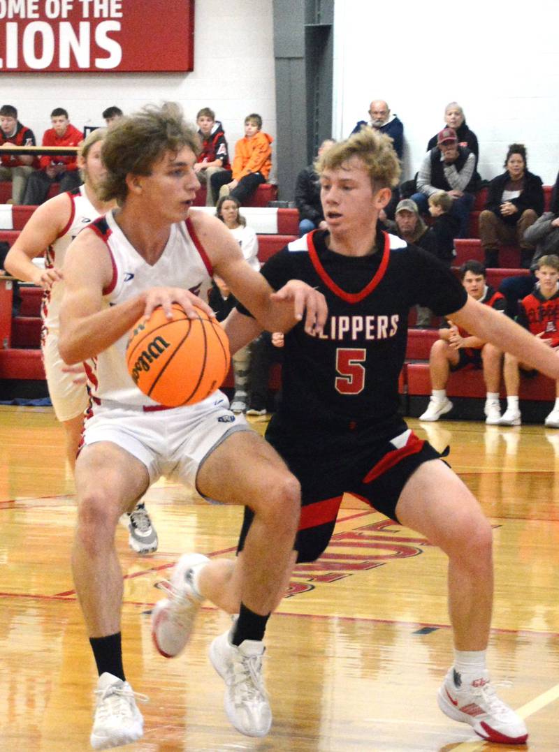 LaMoille's Connor Deering makes his moves against Amboy's Tanner Welch Saturday at Dean Madsen Gymnasium.