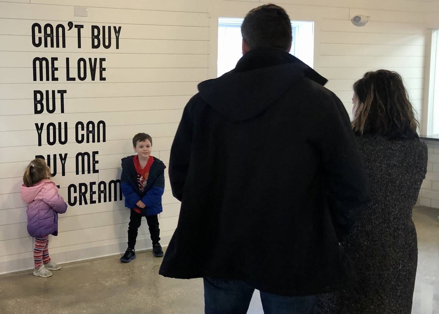 Family takes advantage of photo opportunity with wall art at Dairy Barn. (David Petesch - dpetesch@shawmedia.com)