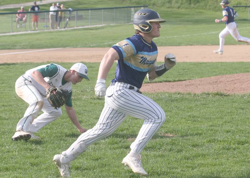 Marquette's Grant Dose runs to first base as St. Bede pitcher Geno Dinges fields a ground ball on Thursday, April 24, 2025 at St. Bede Academy.