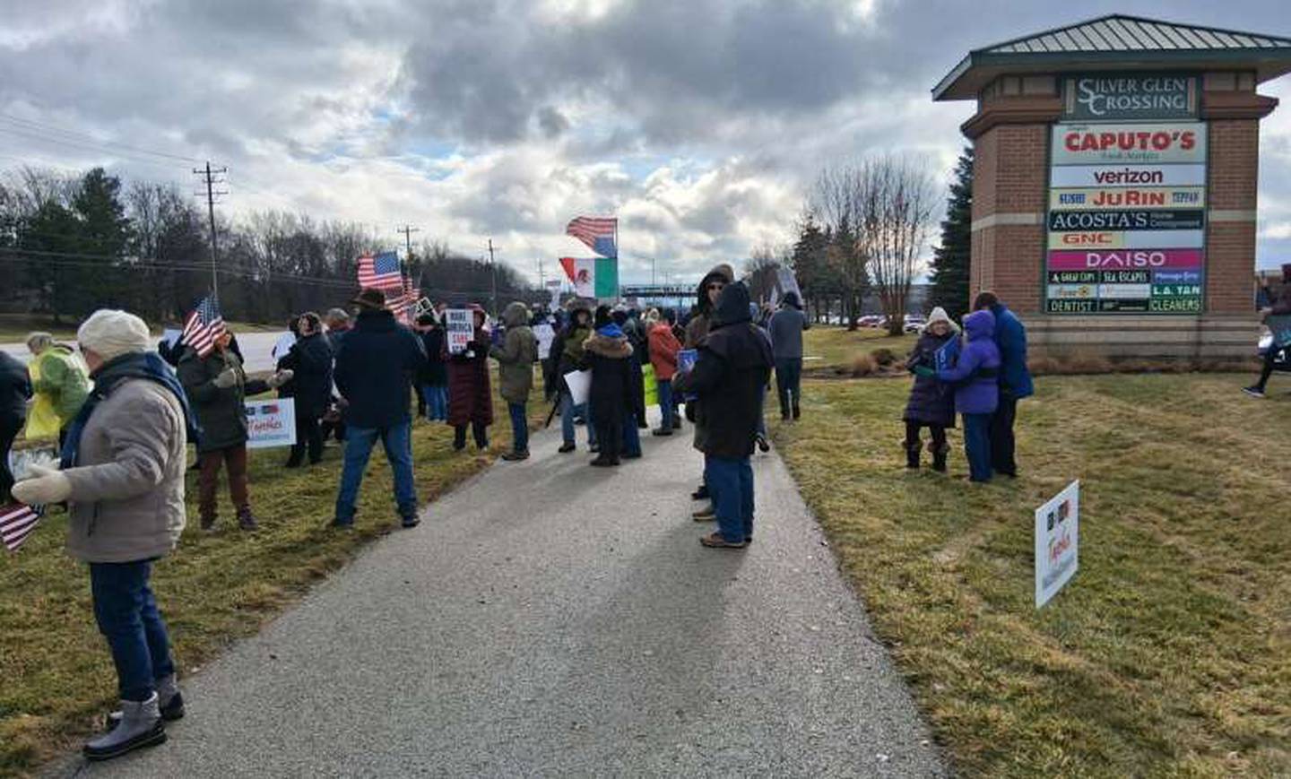 A large crowd gathers along Randall Road in front of the Silver Glen Crossing shopping center in South Elgin on Saturday, Jan. 10, 2026, to protest the Jan. 7, 2026, fatal shooting of Renee Good by an ICE officer in Minneapolis, Minnesota.