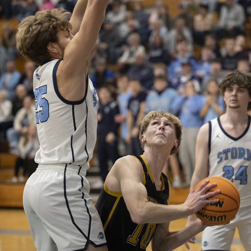Riverdale’s Brody Clark looks to put up a shot while being defended by Bureau Valley’s Landon Hulsing Wednesday, Feb. 26, 2025, at the Class 2A Regional semifinal at Bureau Valley High School.