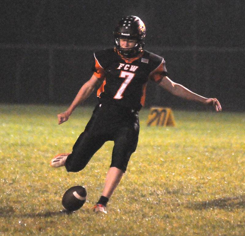 Connor Decker kicks for Flanagan-Cornell/Woodland at Woodland on Friday, Oct. 13, 2023.