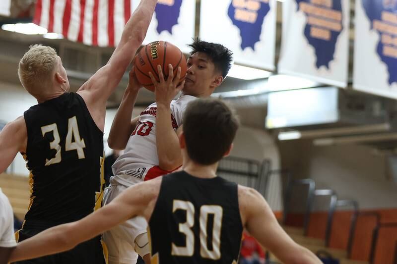 Bolingbrook’s MJ Langit is forced to pass against Andrew in the Class 4A Oswego Sectional semifinal. Wednesday, Mar. 2, 2022, in Oswego.