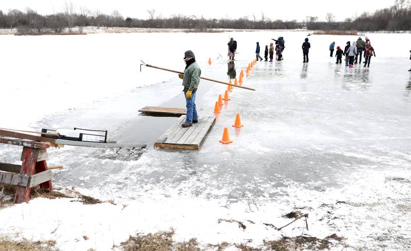 Historical interpreters and participants gather on Timber Lake at Kline Creek Farm to harvest ice on Friday, Jan. 24 2025 in West Chicago.