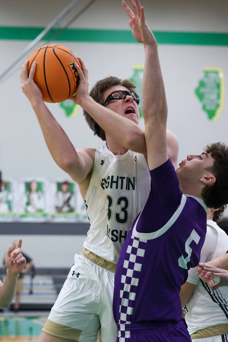 Bishop McNamara's Callaghan O'Connor goes for a layup under pressure from Wilmington's Declan Moran during Bishop McNamara's 61-24 victory over Wilmington in the IHSA Class 2A Seneca Sectional semifinal on Tuesday, March 3, 2026.