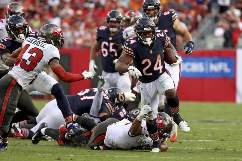 Chicago Bears running back Khalil Herbert (24) rushes the ball against the Tampa Bay Buccaneers, Sunday, Oct. 24th, 2021 in Tampa, Fla. (AP Photo/Don Montague)