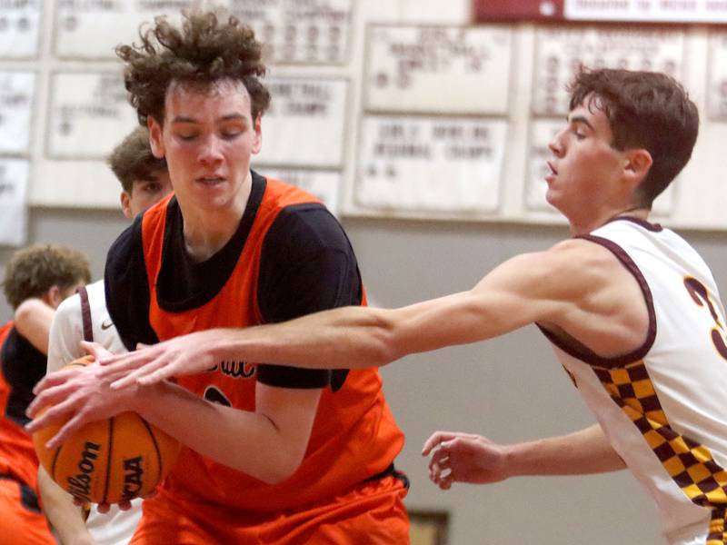 Richmond-Burton’s Dane Gardner, right, guards Crystal Lake Central’s Danny Spychala in varsity boys basketball E.C. Nichols tournament championship game action on Saturday, Dec. 27, 2025, at Homer “Bill” Barry Gymnasium on the campus of Marengo High School in Marengo.