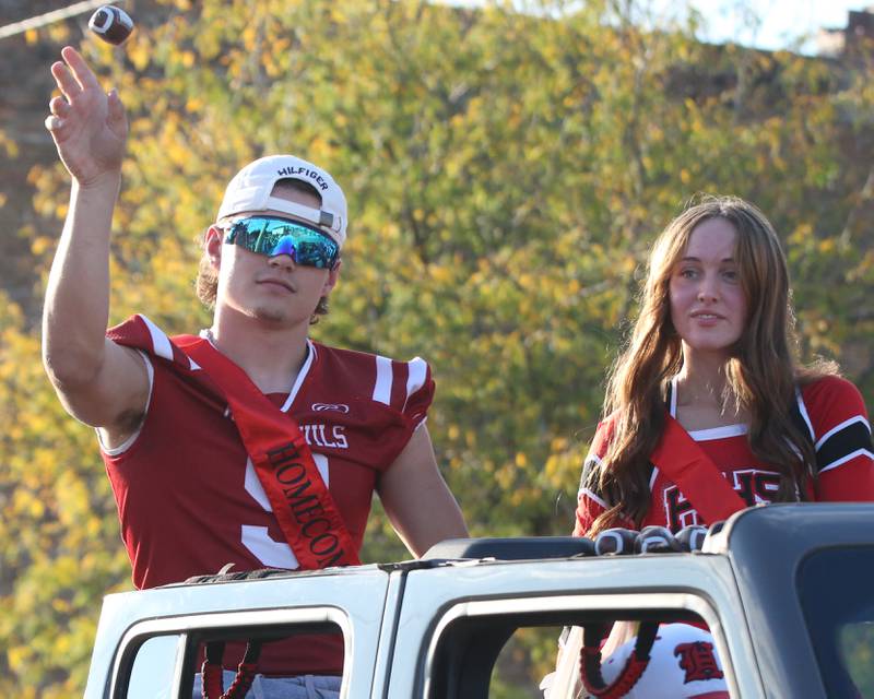 Hall queen and king candidate Gianni Guerrini and Taylor Coutts ride in the Hall High School Homecoming parade on Thursday, Sept. 28, 2023 in Spring Valley. Guerrini was crowned 2023 Homecoming king during a assembly after the parade.