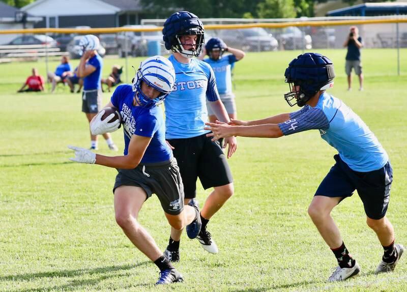 PHS senior Danny Cihocki steers clear of  Bureau Valley's Eli Attig during Monday's 7 on 7 at Little Siberia.