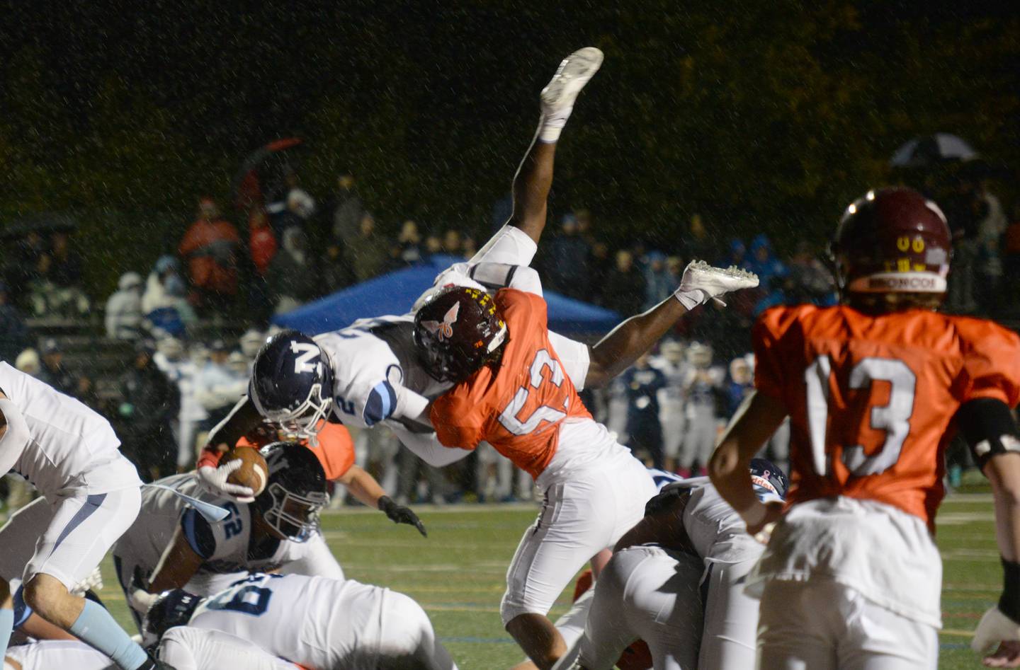 Montini's  Nicky Castaldo helps prevent Nazareth's Justin Taylor from making his way into the end zone during their game Friday Oct 14, 2022.