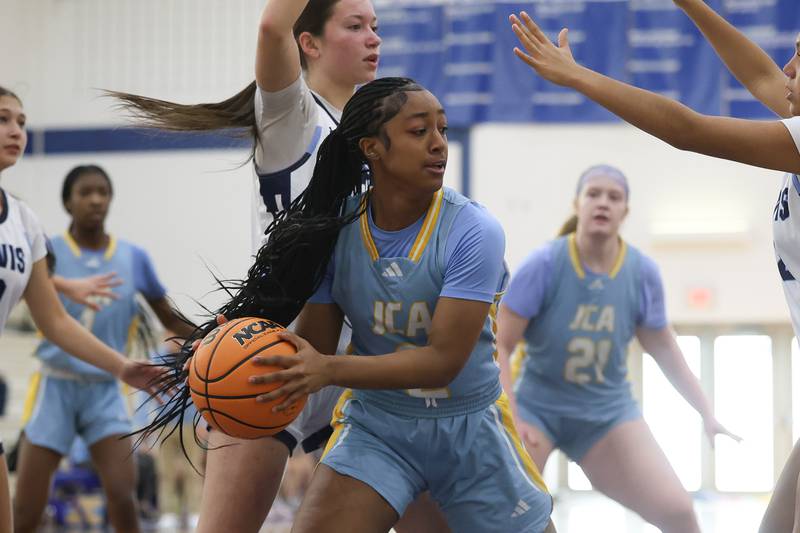 Joliet Catholic’s Gabrielle Gavin looks to pass against Reavis in the Peotone Blue Devils Holiday Classic championship game on Monday, Dec. 29, 2025 in Peotone.
