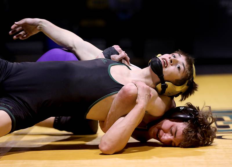 Hampshire’s Andrew Salmieri tries to pin Crystal Lake South’s Alex Perez during the 120-pound match of a Fox Valley Conference wrestling meet on Thursday, Jan. 15, 2026, at Crystal Lake South High School.