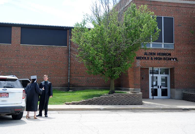Korhny Geary and Tyler Cunningham talk as they wait for the building to open Sunday, May 22, 2022, before the Alden-Hebron High School commencement ceremony in Hebron.