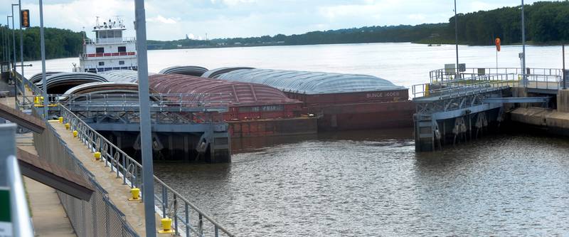 The gates open up for towboat Neil N Diehl as it pushes barges up the Mississippi River through the lock at Lock & Dam 13 near Fulton on Sunday, July 6, 2025.