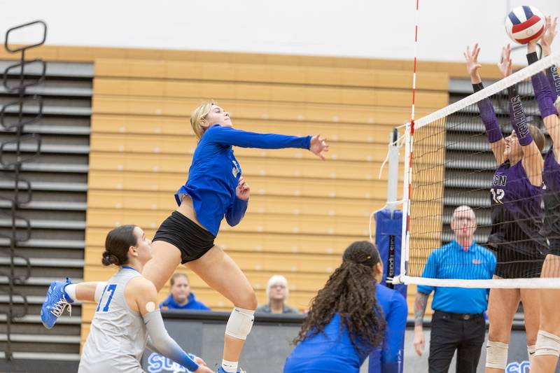 St. Charles North's Amber Czerniak hits a volley against Downers Grove North on Thursday Oct. 23, 2025 in St. Charles.