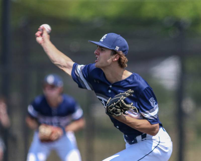 Oswego East's Griffin Sleyko (21) delivers to the plate during Class 4A Romeoville Sectional final game between Oswego East at Oswego.  June 3, 2023.