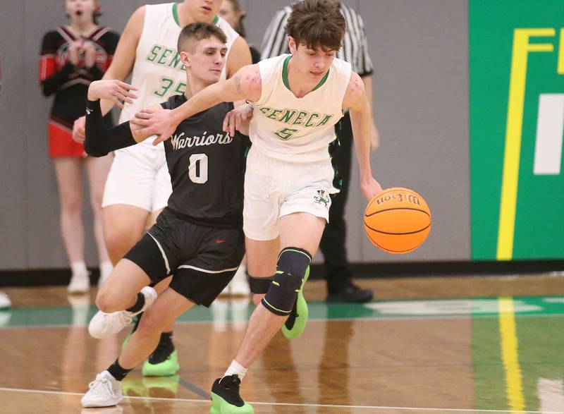 Seneca's Sebastian Deering dribbles the ball away from Woodland's Noah Decker on Friday, Feb. 14, 2025 at Seneca High School.