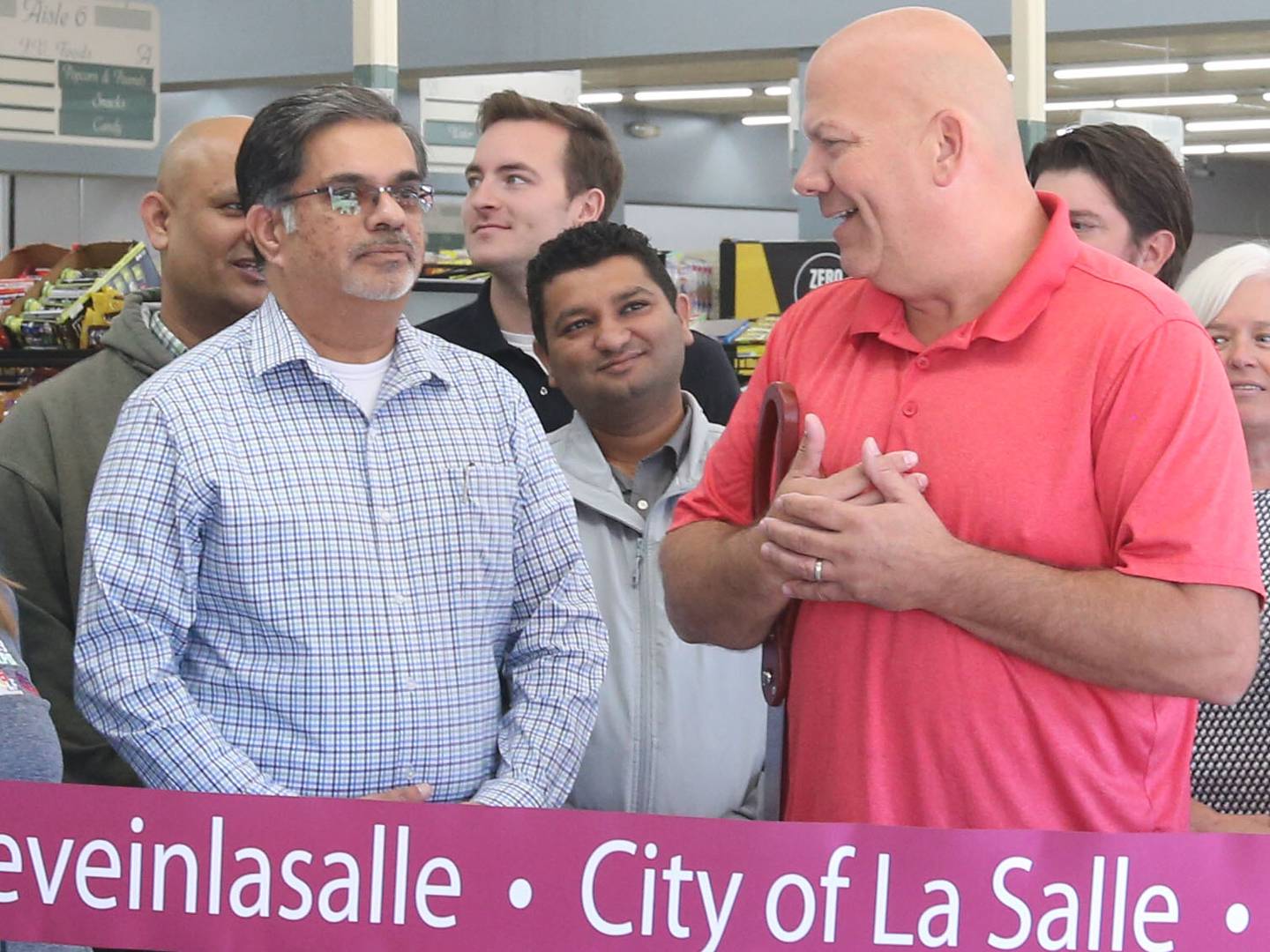 Illinois Valley Food and Deli manager Nick Tharani chats with La Salle Mayor Jeff Grove during a ribbon-cutting celebration on Thursday, Sept. 26, 2024 in La Salle. The grocery store is celebrating it's grand opening this Saturday with a free cookout from 10a.m.-2p.m.