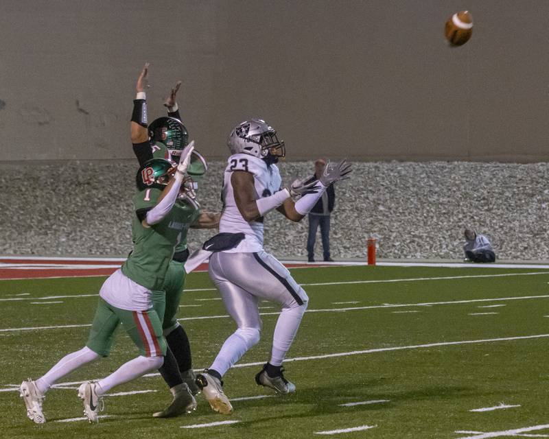 Aric Johnson of Kaneland makes a completion deep in LaSalle Peru High School's side of the field for a large gain of yards during the game on October 20, 2023.
