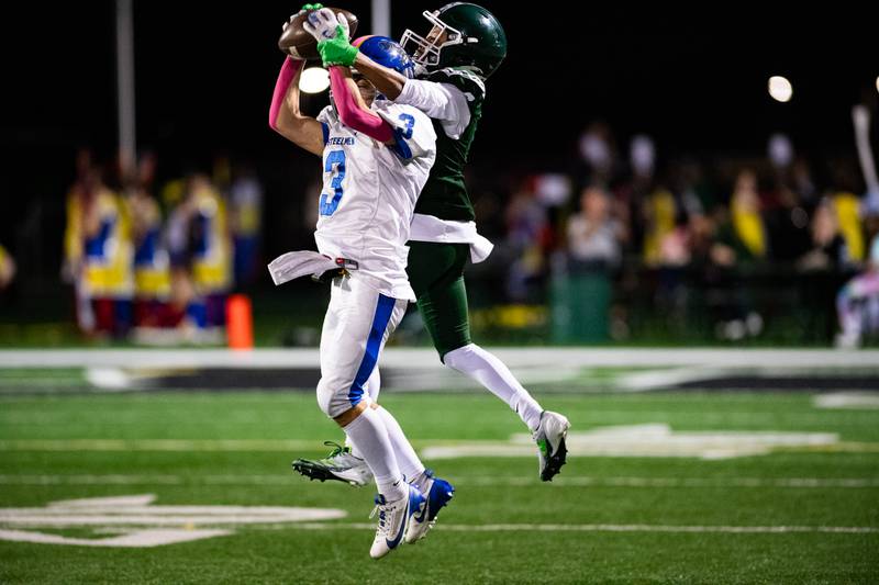Joliet Central's Jayden Poplawski intercepts a pass intended for Plainfield Central's Marshawn Jackson during a game on Friday Oct. 11, 2024 at Plainfield Central High School