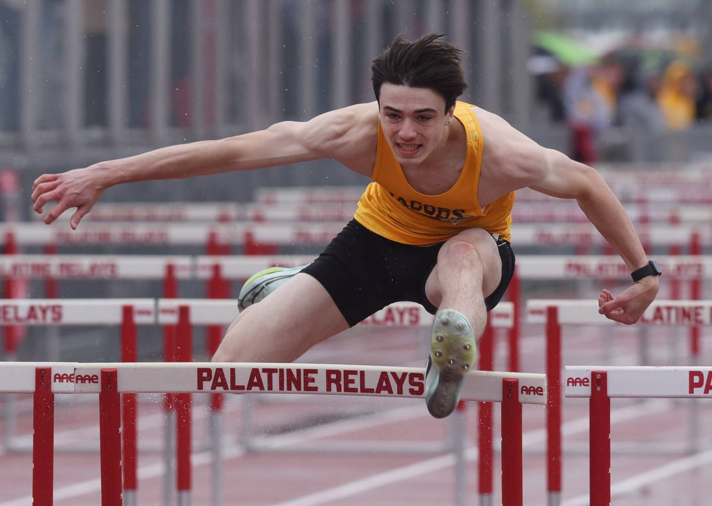 Joe Lewnard/jlewnard@dailyherald.com
Jacobs’ Devan McTague clears the final hurdle in the 110-meter hurdles during the Palatine track and field relays in Palatine Saturday.