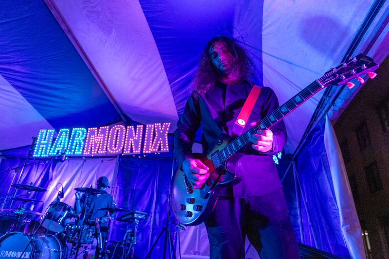 Marco Obaya of Harmonix plays guitar as during the band's performance at Frosty on First on Friday, November 7, 2025 on First Street in La Salle.