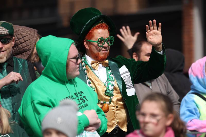 A leprechuan waves from the grand stands at the Plainfield Hometown Irish Parade on Sunday, March 17, 2024 in Plainfield.