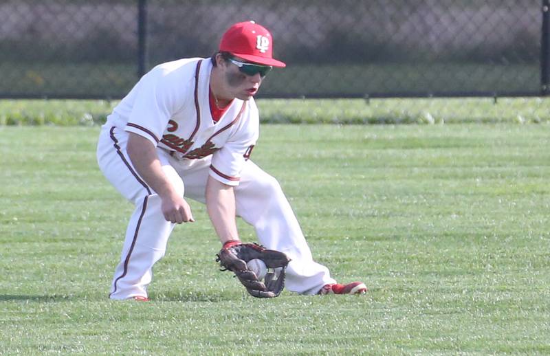 L-P's center fielder Brady Romagnoli fields a ground ball while playing Morris on Friday, April 21, 2023 at Dickinson Field in Oglesby.