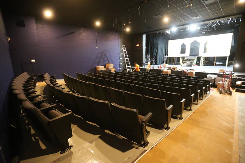 New seats are installed on Monday at Stage 212 in La Salle. Other renovation work at the theater includes a new stage curtain, acoustic panels for the walls, ceiling repairs, HVAC improvements, sound enhancements and lighting upgrades and painting.