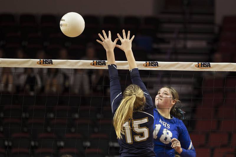 Newman’s Kennedy Rowzee spikes the ball Friday, Nov. 11, 2022 in a class 1A volleyball semifinal against Aquin.