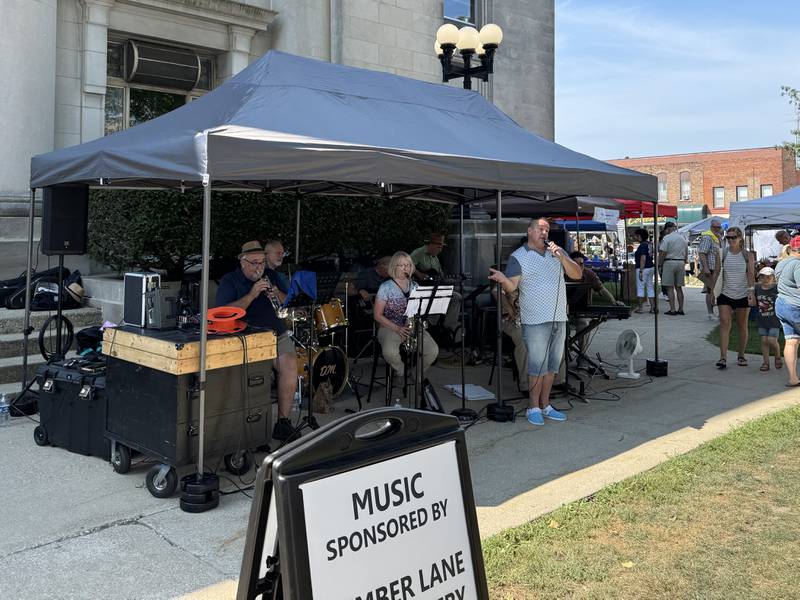 Roy Bachus and Friends perform in front of the Grundy County Courthouse during the Liberty Arts Festival on Saturday, Aug. 16, 2025.