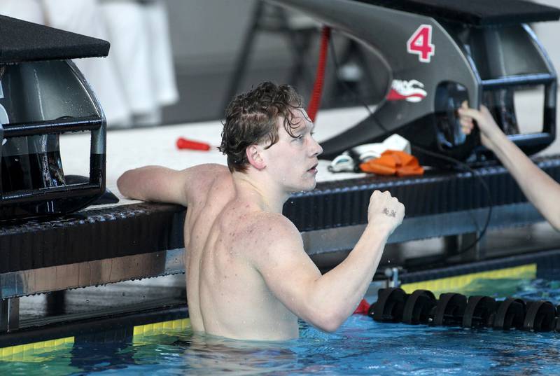 Fenwick’s Mike Flynn celebrates his win in the championship heat of the 200-yard freestyle during the IHSA Boys Swimming and Diving Championships at FMC Natatorium in Westmont on Saturday, Feb. 26. 2022.