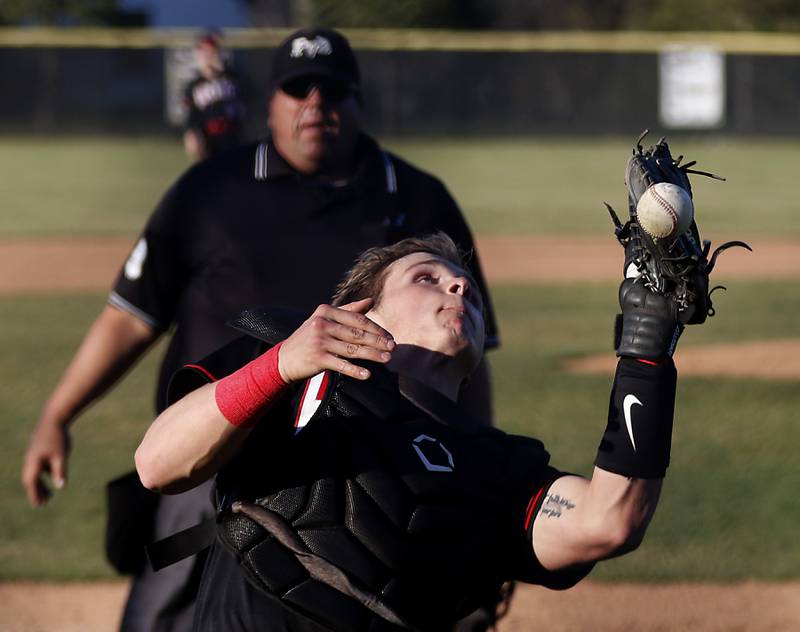 Huntley’s Ryan Bakes tries to catch a foul ball during a Fox Valley Conference baseball game against Huntley Wednesday, April 12, 2023, at Prairie Ridge High School.