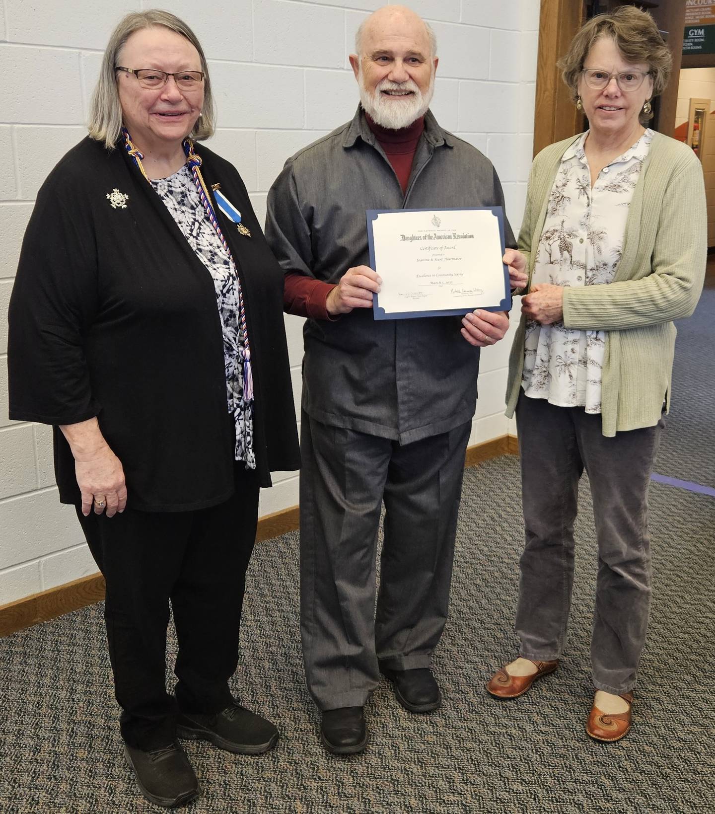 (Left to right); DAR General John Stark Chapter Regent Donna Willrett, Kurt Thurmaier, and Jeanine Thurmaier