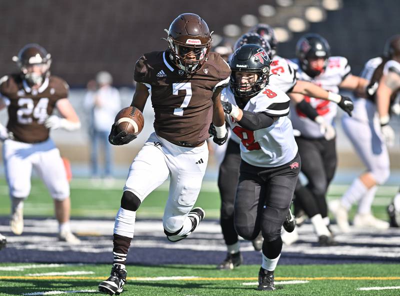 Joliet Catholic Academy's running back Hiram J. Grigsby III (7) runs for a big gaind during the class 5A second round playoff game against Triad on Saturday, Nov. 04, 2023, at Joliet. (Dean Reid for Shaw Local News Network)