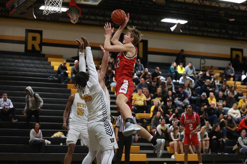 Yorkville’s Jason Jakstys battles for the shot against Joliet West on Friday, Jan. 5th, 2024. in Joliet.