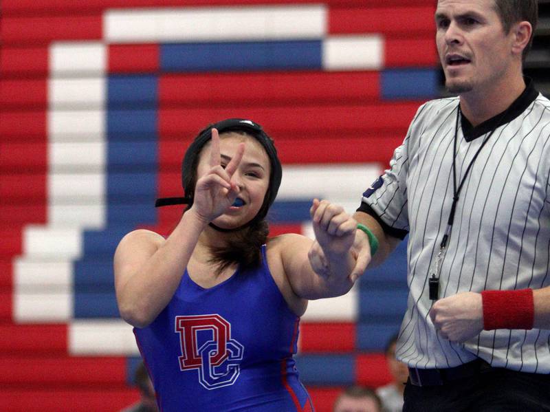 Dundee-Crown’s  Ruby Gavina celebrates after winning a 130-pound bout in girls varsity wrestling over McHenry’s Mackensie Hendricks at Carpentersville Thursday night.