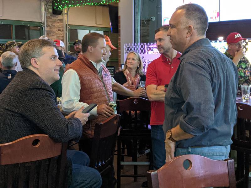 Kendall County State's Attorney Eric Weis, right, talks to Kane County Circuit Clerk Matt Prochaska, left, at Mike & Denise's Pizzeria & Pub in Yorkville. Both Weis and Prochaska are headed for reelection, according to unofficial results.
