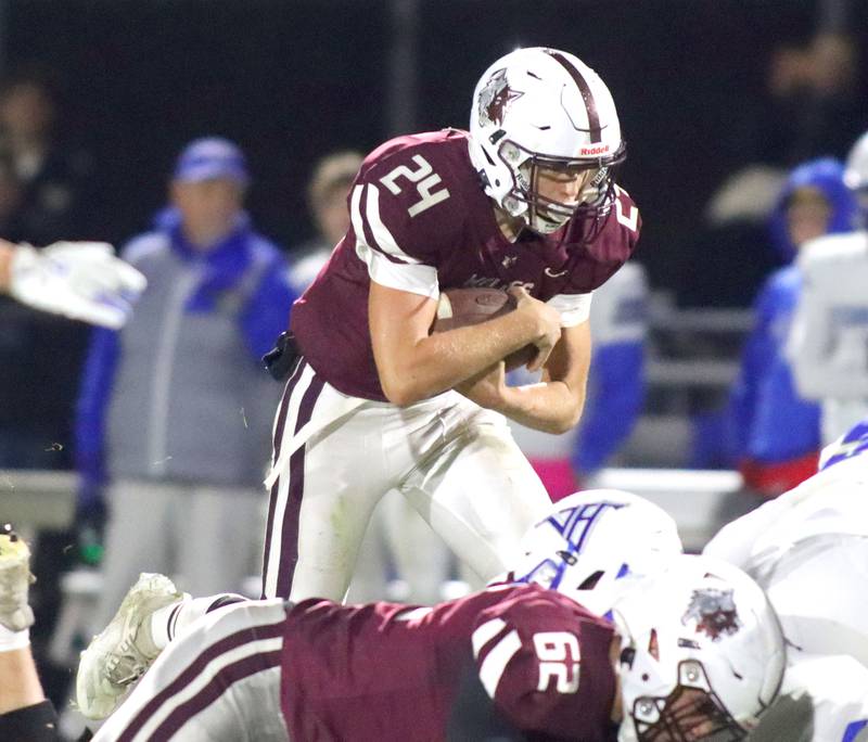 Prairie Ridge’s Vincent Byk runs the ball against Vernon Hills in IHSA football Class 5A first-round playoff action at Prairie Ridge High School in Crystal Lake on Friday, October 31, 2025.