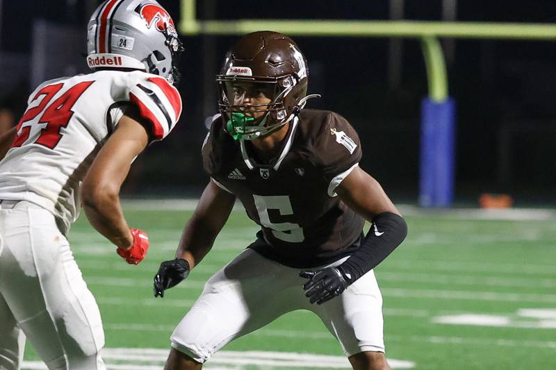 Joliet Catholic’s Anthony Brown squares off with the receiver against Iowa City on Friday, August 30, 2024 in Joliet.