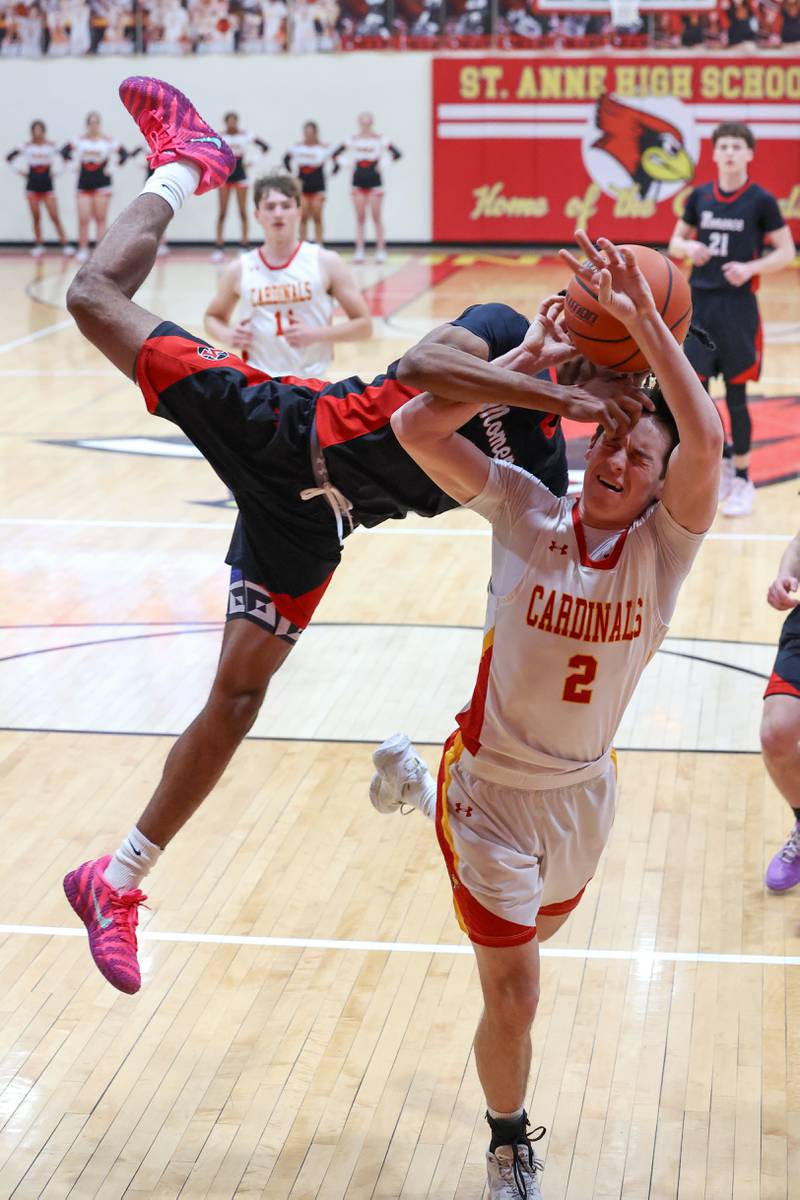 Momence's D'Angelo Hundley fouls St. Anne's Matthew Langellier (2) during St. Anne's 64-43 victory in the River Valley Conference semifinals on Tuesday, Feb. 10, 2026.