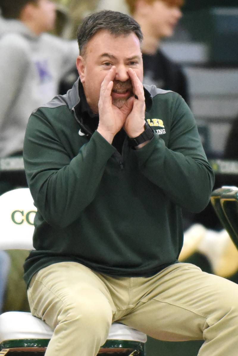 Coal City wrestling coach Mark Masters instructs one of his wrestlers during the IHSA Class 1A Coal Cty Sectional Saturday, Feb. 15, 2025.