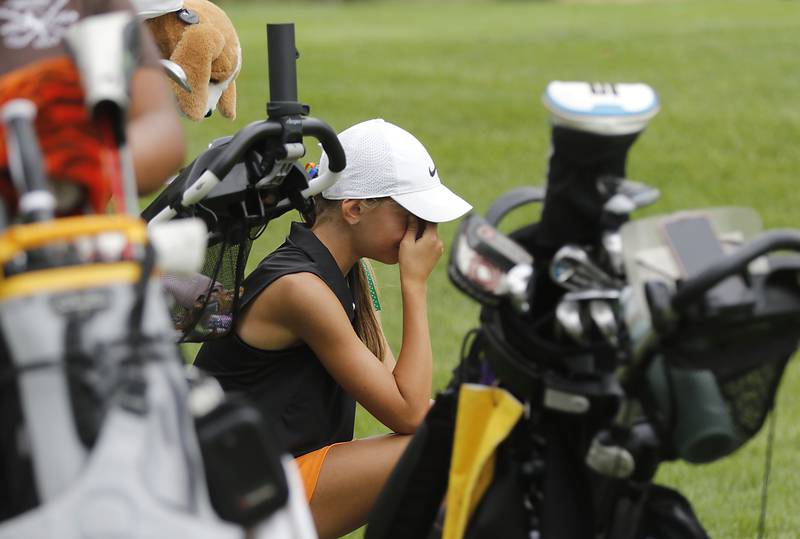 Crystal Lake Central co-op’s Giuliana Dickson gathers her emotions after playing the 12th hole during the Fox Valley Conference Girls Golf Tournament Wednesday, Sept. 24, 2025, at Crystal Woods Golf Club in Woodstock.